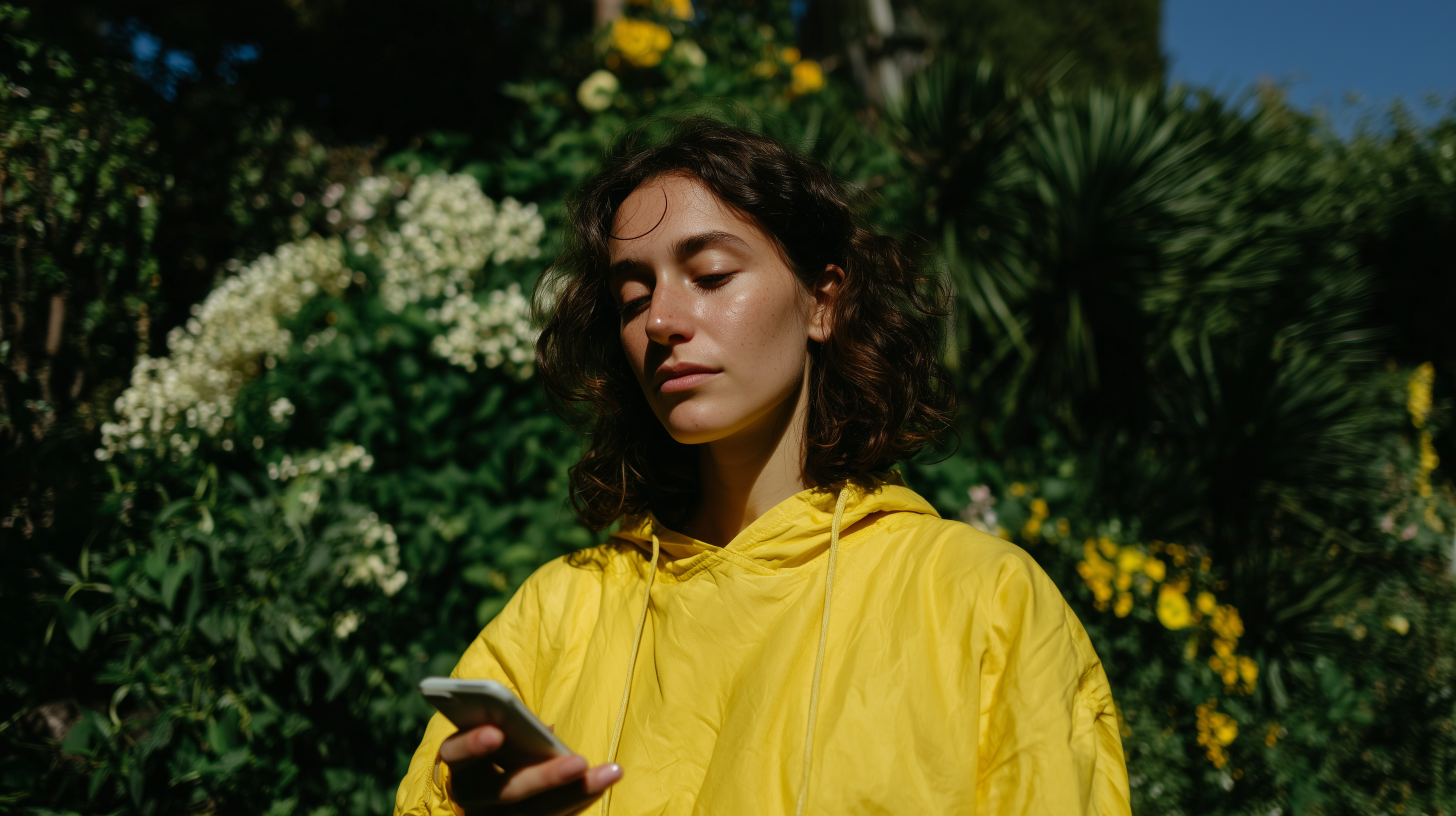 Woman outdoors checking Merlin on her phone